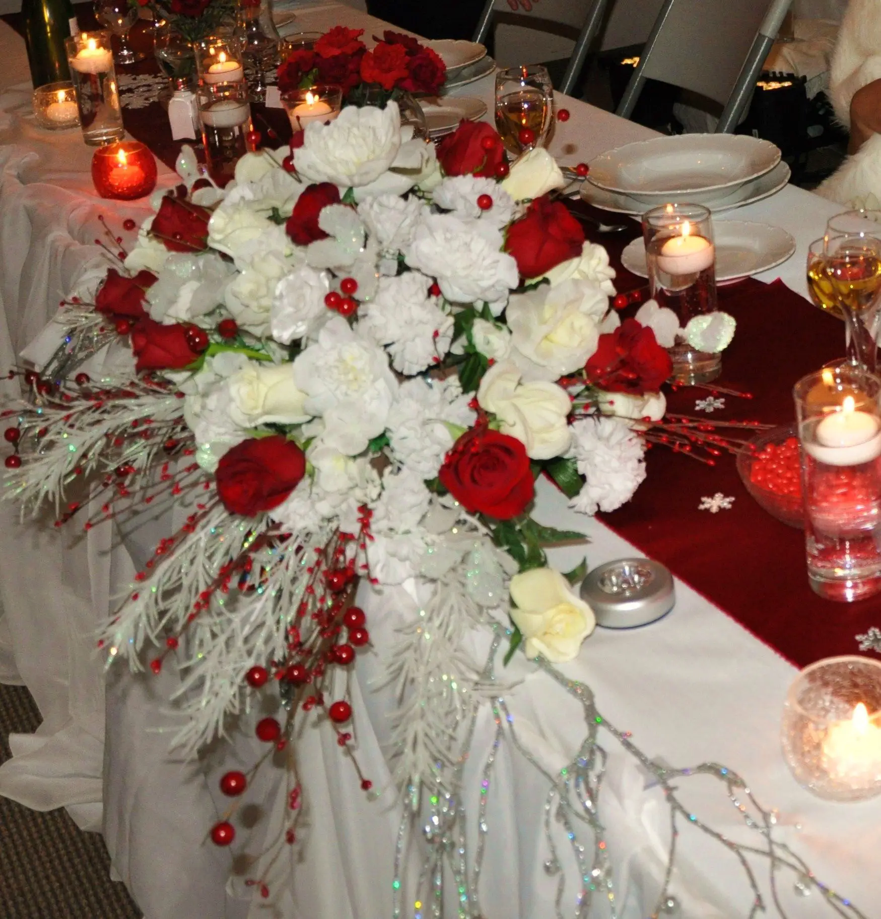 Red and white winter themed wedding, berries, frosted branches, flowers ...