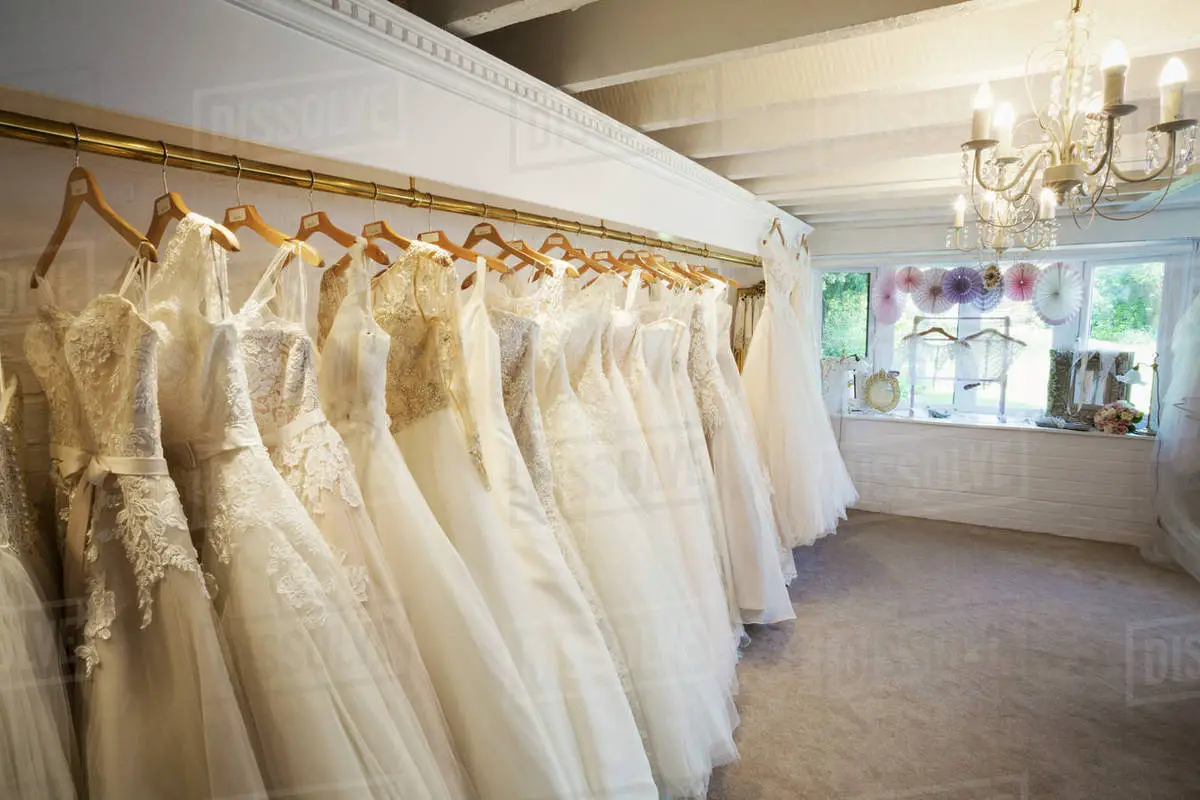 Rows of wedding dresses on display in a specialist wedding ...